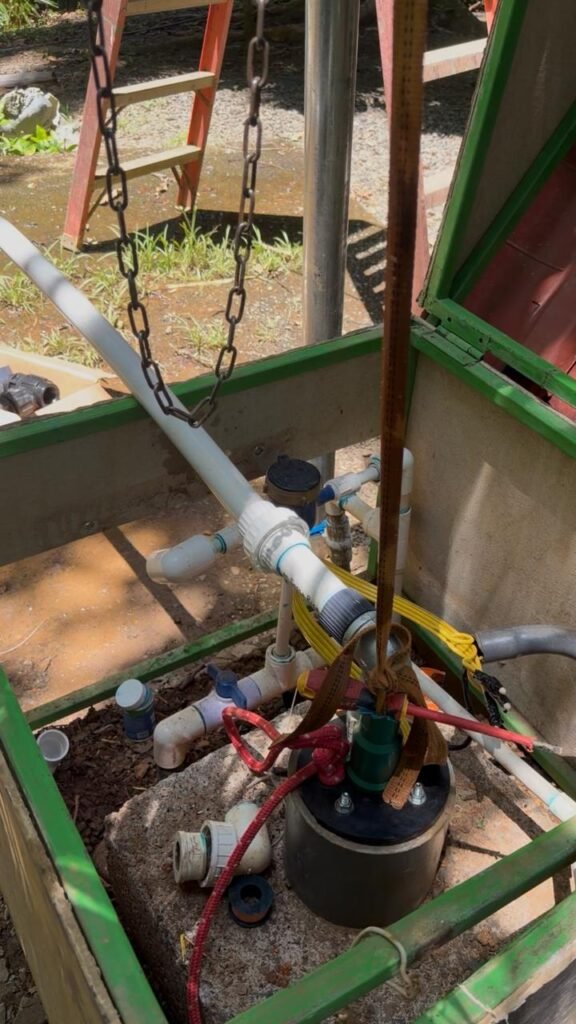 Water well and pump equipment during a well permit and pumping test in Costa Rica